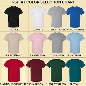 Puede incluir: Una tabla de selecci&oacute;n de colores de camisetas que muestra doce camisetas de manga corta y cuello redondo en varios colores numeradas del 1 al 12: Negro, Blanco, Gris deportivo, Azul real, Beige/Arena, Rosa claro, Gris ceniza, Azul cielo, Rojo cereza antiguo, Granate, Verde bosque y Verde azulado.