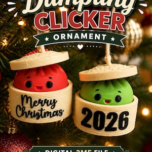 May include: Two hanging ornaments shaped like dumplings in bamboo steamers. One red dumpling features the text Merry Christmas, and one green dumpling features the text 2026. The text Dumpling Clicker Ornament is displayed above the items.