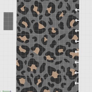 May include: A rectangular planner insert page featuring a gray background with a repeating black and tan leopard print pattern. The right edge of the page has a series of semi-circular cutouts designed for a disc-bound binding system.