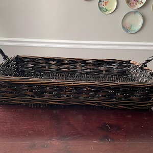 May include: A set of three ceramic mugs with a speckled, matte finish. The mugs are in shades of cream, light gray, and dark gray. Each mug has a simple, minimalist design and a rounded handle.