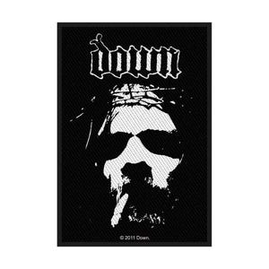 May include: Black and white patch with the band name "Down" in a stylized font above a skull graphic. The skull has a dotted pattern and is wearing sunglasses. The text "© 2011 Down." is at the bottom.
