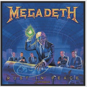 May include: A square fabric patch featuring the Megadeth Rust in Peace album artwork. It depicts a skeletal figure in a suit holding a glowing green object above a missile, with four men in suits in the background and the text Rust in Peace.