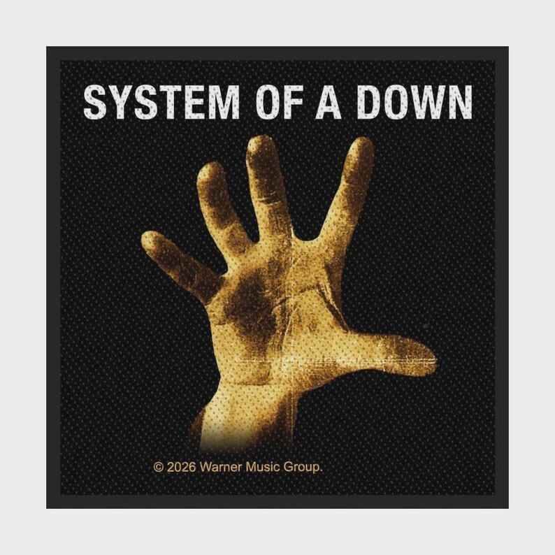 May include: A square black patch featuring the white text SYSTEM OF A DOWN at the top. In the centre is a golden-brown, textured handprint graphic. At the bottom, the text reads &copy; 2026 Warner Music Group. The design has a dotted pattern.