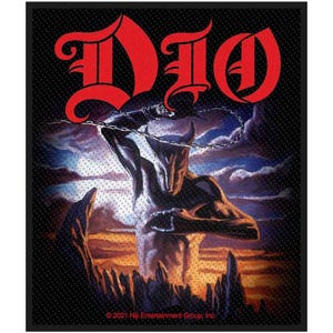 May include: A black patch with the red word "Dio" in a stylized font. The image shows a muscular, horned figure wielding a chain, set against a cloudy sky and rocky landscape. The bottom of the patch has the text "© 2021 Niji Entertainment Group, Inc."