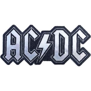 May include: A rectangular embroidered patch featuring the text AC/DC in a bold, stylized font. The letters are silver with a metallic sheen, outlined in thick black thread. A central lightning bolt symbol separates the AC and DC characters.