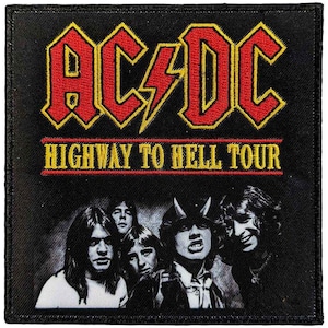 May include: Black square patch with the AC/DC logo in red with a yellow outline and a lightning bolt. The text "HIGHWAY TO HELL TOUR" is below the logo in yellow. A black and white image of the band members is at the bottom of the patch.
