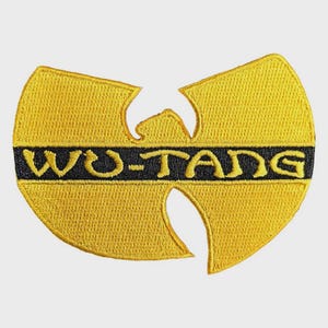 May include: A yellow and black embroidered patch featuring the Wu-Tang Clan logo. The design consists of a stylised yellow W shape with a horizontal black stripe across the centre containing the yellow text WU-TANG in a bold font.