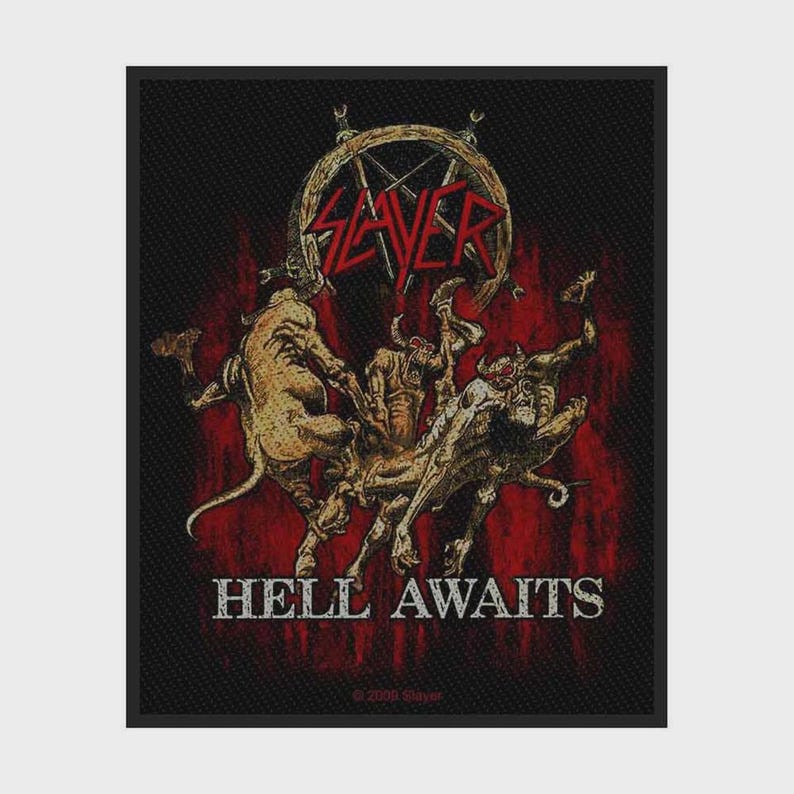 May include: A rectangular black fabric patch featuring a graphic illustration of several horned, tan-coloured demonic figures. Above the figures is the red Slayer logo, and below them is the white text HELL AWAITS in a bold, distressed font.