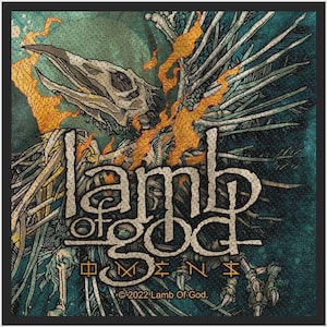 May include: A square fabric patch featuring a skeletal bird illustration with orange flame-like accents against a dark teal background. The text "lamb of god" is centred in a stylised font above the word "OMENS" and "©2022 Lamb Of God."