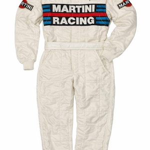 May include: Cream-coloured racing suit with the "MARTINI RACING" logo across the chest. The suit features red, blue, and black stripes, along with sponsor patches. It has a quilted design and a belt at the waist.