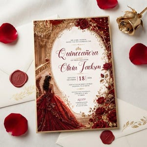 May include: A rectangular Quinceañera invitation card featuring a central oval frame with a gold border. The design displays a person in a red ballgown on a staircase, surrounded by deep red roses and gold accents, with printed text details.