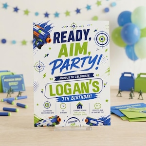 May include: A rectangular birthday party invitation card with a white background, blue and green text, and toy blaster graphics. The text reads READY, AIM, PARTY! JOIN US TO CELEBRATE LOGAN'S 7TH BIRTHDAY! with event details including date, time, and location.
