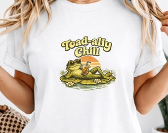 Krötenanhänger Chill-Frosch-T-Shirt, lustiges entspannendes Frosch-T-Shirt, wunderliches Frosch-Shirt, niedlicher Frosch mit Getränkegrafik, Retro Sonnenuntergang-Frosch-T-Stück