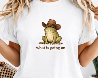 Was los ist, Frosch Cowboy Shirt, lustiges konfuses Meme T-Shirt, süßes Western Frosch Shirt, sarkastischer Humor Frosch Grafik Shirt, wunderliches Frosch T-Shirt