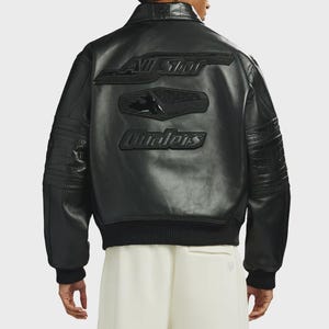 May include: Black leather jacket with embossed lettering on the back. The jacket has a ribbed hem and cuffs, and features the words "All Star" and "Cavaliers". The jacket has a classic bomber style.