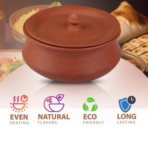 May include: A terracotta cooking pot with a lid. The pot is a warm reddish-brown color and has a rounded shape. The lid has a small knob on top. The image also includes text that says "EVEN HEATING", "NATURAL FLAVORS", "ECO FRIENDLY", and "LONG LASTING".