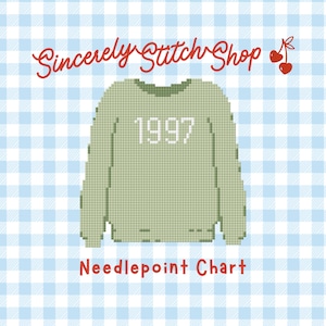 May include: A needlepoint chart with a pixelated design of a green sweater with the number "1997" in white. The text "Sincerely @ Stitch Shop" is in red script, and "Needlepoint Chart" is in red block letters. The background is a blue and white gingham pattern.