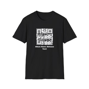 May include: Black t-shirt with a QR code design and the words "Album Cover!" in white. Underneath the QR code, the text reads "Album Name (Release Year)". The t-shirt has a crew neck and short sleeves.