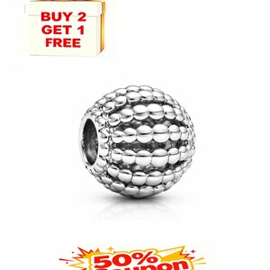 May include: A silver bead charm with a textured, bubble-like surface. The charm has a hole for threading onto a bracelet or necklace. The image also includes a gift box with a gold bow and the text "BUY 2 GET 1 FREE".
