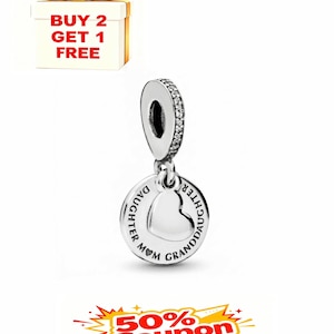 May include: A silver charm with a heart design, inscribed with "MOM DAUGHTER GRANDDAUGHTER". The charm has a loop adorned with small, clear stones. The image also includes a gift box with a gold bow and the text "BUY 2 GET 1 FREE".