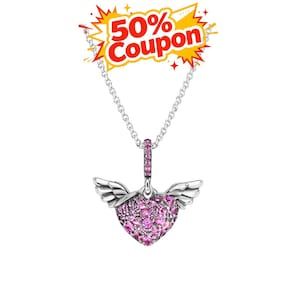 May include: A silver necklace with a pendant shaped like a heart with wings. The heart is covered in pink gemstones. The necklace has a chain and a clasp. A coupon graphic is in the top left corner.