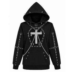 May include: A black hooded sweatshirt featuring a white cross graphic with a mesh texture. The garment is adorned with silver-toned metal studs, black faux leather straps, metal O-rings, and silver chains draped across the chest and sleeves.