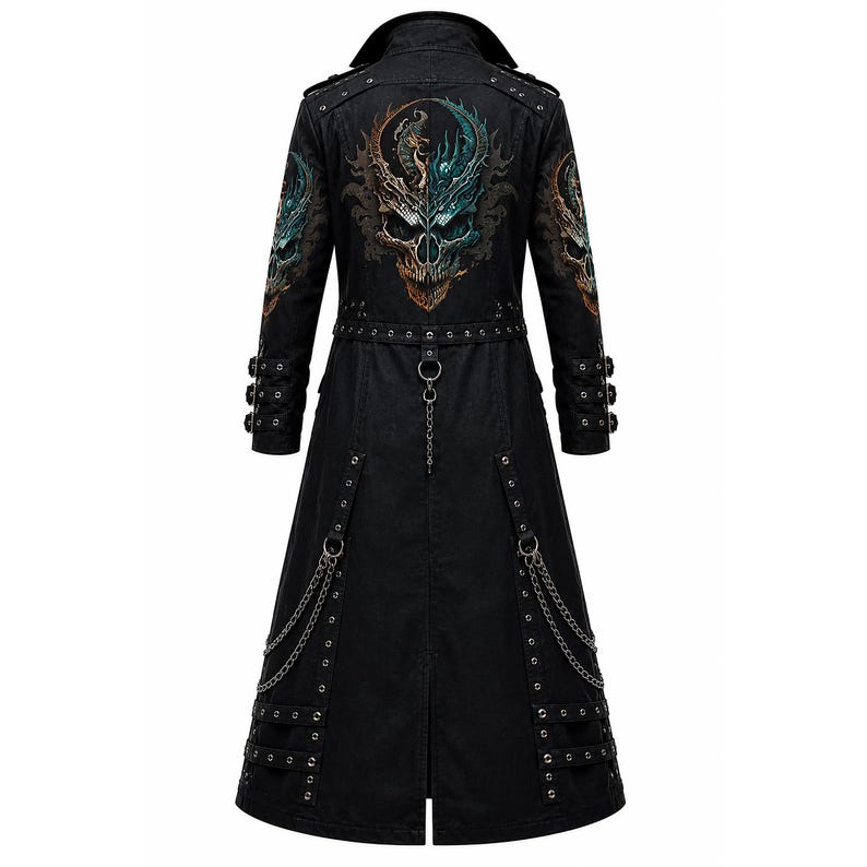 May include: A black long coat featuring a large, detailed graphic of a skull with dragon-like elements on the back. The coat includes metal eyelets, multiple buckled straps on the sleeves and lower hem, and decorative silver-toned chains attached to rings.