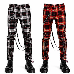 Pode incluir: Duas calças xadrez com botas pretas. Uma é xadrez preto, vermelho e branco, a outra xadrez vermelho, preto e amarelo. Ambas têm zíperes, alças e ferragens prateadas. Em um fundo branco.