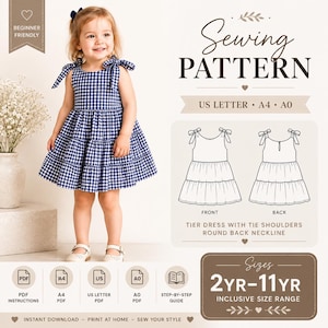 May include: A sewing pattern for a tiered dress with tie shoulders and a round back neckline. The pattern includes US Letter, A4, and A0 formats for sizes 2YR-11YR. The design features a blue and white gingham print, shown on a child.