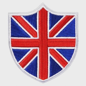 May include: A shield-shaped patch featuring the Union Jack, the national flag of the United Kingdom. The design includes a red cross and diagonal stripes on a blue background, outlined in white.