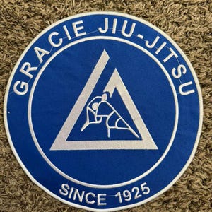 May include: A set of three ceramic mugs with a speckled, matte finish. The mugs are in shades of cream, light gray, and dark gray. Each mug has a simple, minimalist design, perfect for coffee or tea.