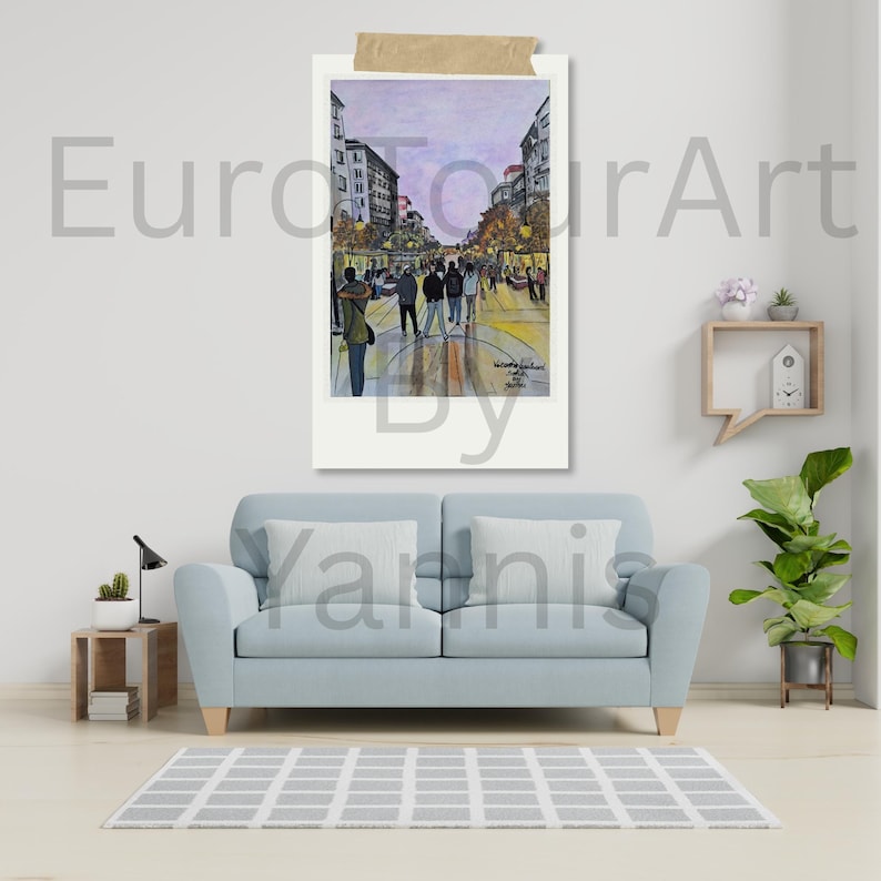 May include: Watercolor painting of a European street scene, framed in a white border and taped to a wall. The artwork depicts a bustling street with buildings, people, and a soft, colorful palette. The artist's signature is visible.