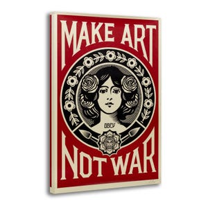 May include: A rectangular art print with a red background and cream-colored border. The print features a central circular design with a woman's face, surrounded by flowers and the text "MAKE ART NOT WAR".