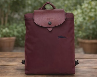 Mochila vintage Longchamp Le Pliage Mini de nailon color vino, bolso de viaje plegable de diseño.