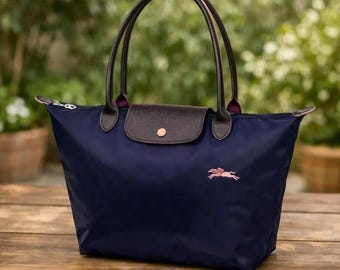 Vintage grote paarse nylon draagtas Longchamp Le Pliage, opvouwbare designer schoudertas