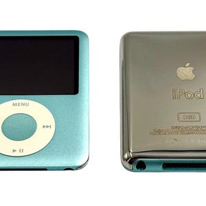 May include: A light blue digital music player with a black screen and a white circular navigation wheel. The reverse side is a polished silver metal finish featuring the Apple logo, the text iPod, 8GB capacity, and regulatory markings.