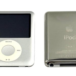 May include: A silver digital music player with a black screen and a white circular navigation wheel featuring the text MENU. The reverse side is a polished chrome finish with an Apple logo, the text iPod, 8GB, and various regulatory symbols.