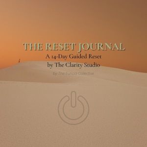 May include: Image of a journal titled "THE RESET JOURNAL" with the subtitle "A 14-Day Guided Reset" by The Clarity Studio and The Eunoia Collective. The background is a desert landscape with a power button graphic.
