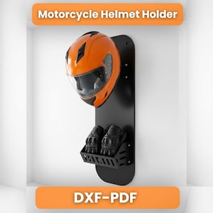 May include: A black wall-mounted motorcycle helmet holder featuring a vertical panel with a rounded top. An orange motorcycle helmet is positioned on the upper section, and a pair of black gloves rests in a slotted storage tray at the bottom.
