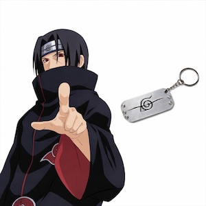 May include: A silver-coloured keychain with a black graphic of a spiral and line design. The keychain is attached to a silver chain and ring. The image also features a character from an anime series.