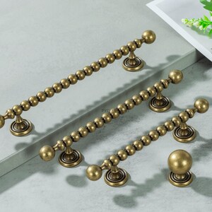 Tiradores de latón antiguo para armarios, pomos y tiradores únicos para cajones de cocina, herrajes cromados dorados para armarios.