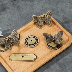 Tiradores de mariposa con placa, herrajes únicos para tiradores de armarios, herrajes de latón macizo para tiradores de cajones de cómoda.