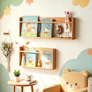 May include: Two wooden bookshelves mounted on a wall, each holding children's books with colorful illustrations. Decorative figurines, including a reindeer and a sheep, sit on the top shelf. The wall is painted with pastel clouds and stars, creating a whimsical nursery theme.