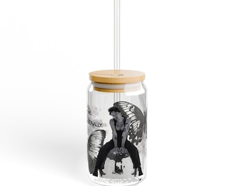 May include: A clear glass tumbler with a bamboo lid and a clear straw. The tumbler features a black and white graphic of a person sitting on a disco ball with butterfly wings. Text on the side reads "ALL THE TIME PROFESSIONALLY."