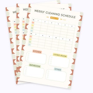 May include: A stack of three weekly cleaning schedule sheets. The sheets have a cream background with a grid for tasks and colorful boxes for rooms. The top sheet reads "WEEKLY CLEANING SCHEDULE".
