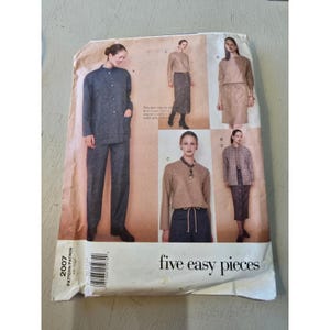 May include: A vintage sewing pattern titled "2007 PATTERN/PATRON" featuring five easy pieces. The pattern shows illustrations of a woman wearing various outfits, including a suit, skirt, and top. The words "five easy pieces" are printed in white.
