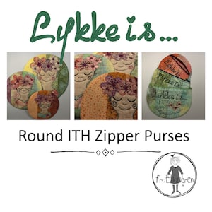May include: Three round zippered purses with a colourful floral design and the text "Lykke is..." embroidered on them. The purses are made with a patchwork fabric and are stacked on top of each other. The image also includes the text "Round ITH Zipper Purses" and a logo for "fru Blomgren".