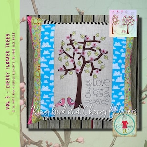 May include: Embroidered design of a cherry blossom tree with two birds perched on a branch. The design includes the words "Love, magic, fun, joy, peace, harmony". The design is on a pillow with a blue and white striped border.