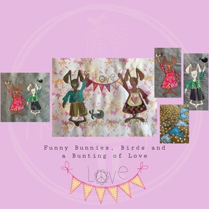 May include: A colorful patchwork quilt with a whimsical design featuring bunnies, birds, and a bunting that says "Love".