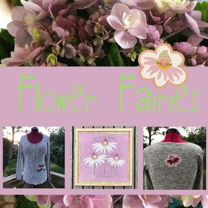 May include: A collage of images featuring flower fairies. The top image shows a pink flower with a fairy face in the center. The middle image shows the text "Flower Fairies" in green letters on a pink background. The bottom images show two gray long-sleeved shirts with embroidered flower fairies. One shirt shows the back of the shirt and the other shows the front of the shirt. The front shirt has three flower fairies embroidered on it. The back shirt has one flower fairy embroidered on it. The shirts are on mannequins. The image also shows a framed picture with a pink background and three flower fairies with white petals and pink centers. The picture has the text "Little Flower Fairies" at the top and "Sweetest Wishes" at the bottom.